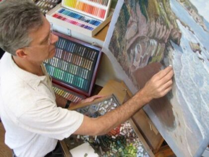 artist in his studio painting